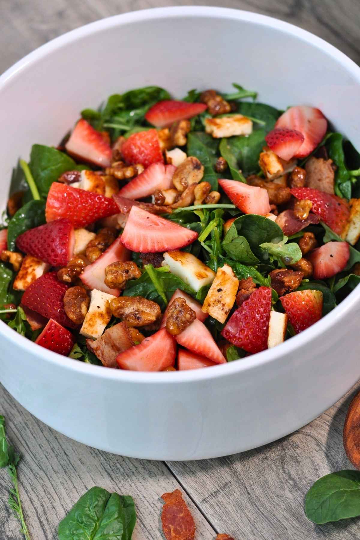 arugula and spinach salad in white bowl