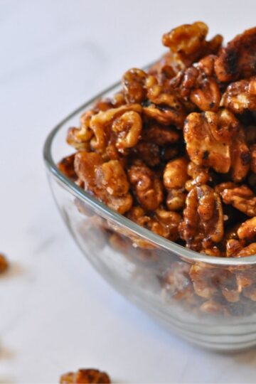 glass bowl of glazed "candied" walnuts