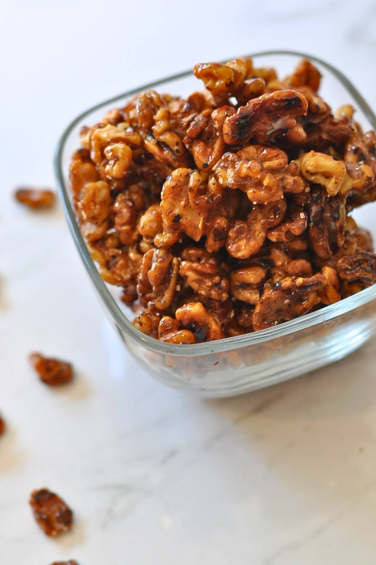 glass bowl with glazed walnuts